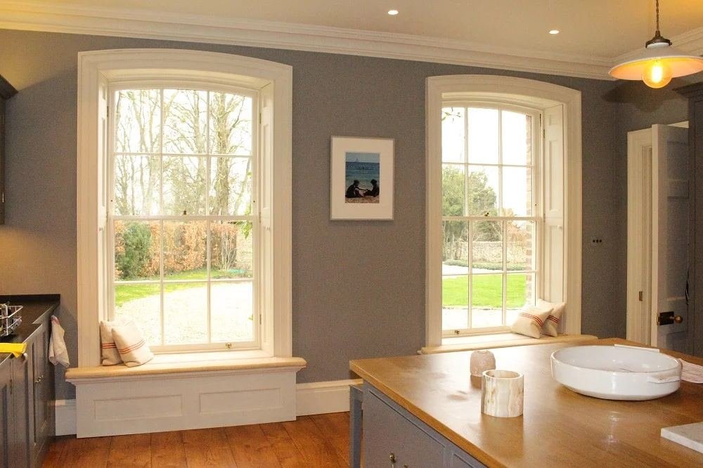 Arched sash windows viewed from a kitchen interior