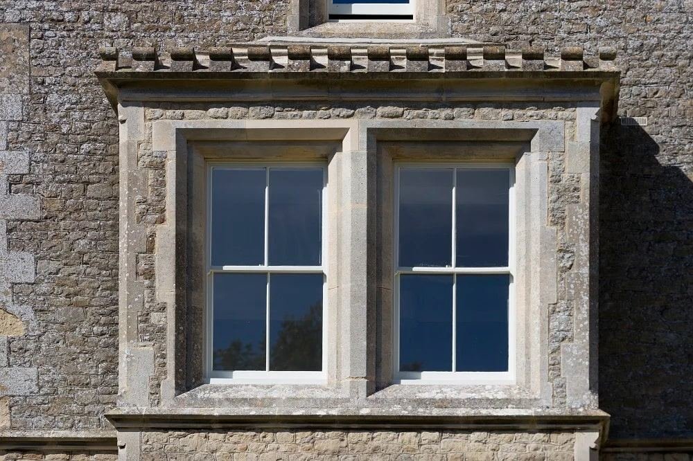 Stone-framed sash windows on a period building
